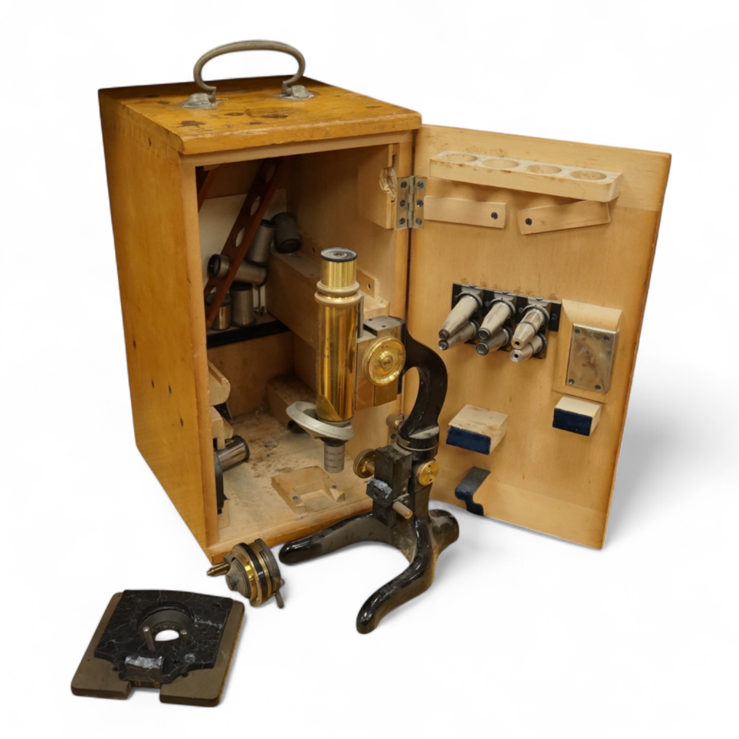 An early 20th century E. Leitz, Wetzlar, monocular microscope, in a cedar case, together with a number of alternative lenses and other accessories, case height 37.5cm.